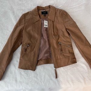Small le chateau faux leather jacket. Tan/caramel color. Brand new with tags